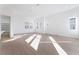 Sunlit living room with hardwood floors and an open concept at 655 Spotted Falcon St, Las Vegas, NV 89138