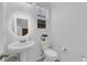 Clean and well-lit half bathroom with classic fixtures and vanity sink at 734 Last Dance Pl, Henderson, NV 89011