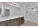 Spacious bathroom with double sinks, a large mirror, and a glass-enclosed shower at 734 Last Dance Pl, Henderson, NV 89011