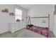 Cozy ' bedroom with a comfortable floor bed, dresser, and natural light at 734 Last Dance Pl, Henderson, NV 89011