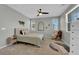 Serene bedroom with a ceiling fan, rocking chair, and soft, neutral tones throughout at 734 Last Dance Pl, Henderson, NV 89011