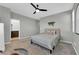 Bedroom with neutral carpet, bedding, and light gray walls and ceiling at 734 Last Dance Pl, Henderson, NV 89011