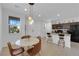 Dining area featuring an island and open view to the kitchen at 734 Last Dance Pl, Henderson, NV 89011