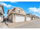 Attractive two-story townhome featuring a spacious two car garage and well-maintained front yard at 734 Last Dance Pl, Henderson, NV 89011
