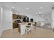 Kitchen and living area offering open layout, island seating, and modern finishes at 734 Last Dance Pl, Henderson, NV 89011