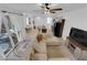 Spacious living room with a large sectional couch and open access to the kitchen at 734 Last Dance Pl, Henderson, NV 89011