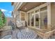 Inviting patio with comfortable seating, decorative rug, and seamless access to the home's interior at 734 Last Dance Pl, Henderson, NV 89011