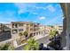 Aerial view of a community with Spanish-style architecture, featuring lush landscaping and private garages at 2555 Hampton Rd # 4308, Henderson, NV 89052