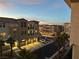 Night view of an apartment community, showcasing the building's exterior illumination and landscaping at 2555 Hampton Rd # 4308, Henderson, NV 89052