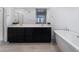 Elegant bathroom with double vanity, soaking tub, and large mirror at 2555 Hampton Rd # 4308, Henderson, NV 89052