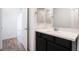 Modern bathroom with dark vanity and wood-look floors at 2555 Hampton Rd # 4308, Henderson, NV 89052