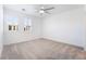 Bright bedroom with neutral-toned carpet, ceiling fan, and window with plantation shutters at 2555 Hampton Rd # 4308, Henderson, NV 89052