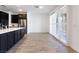 Bright dining area with sliding glass doors and wood-look tile flooring at 2555 Hampton Rd # 4308, Henderson, NV 89052