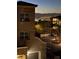 Night view of building exterior overlooking city lights and mountains in the distance at 2555 Hampton Rd # 4308, Henderson, NV 89052