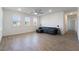 Spacious living room with wood-look floors and a ceiling fan at 2555 Hampton Rd # 4308, Henderson, NV 89052