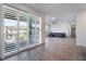 Spacious living room with sliding glass doors and a view of the balcony at 2555 Hampton Rd # 4308, Henderson, NV 89052