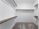 Spacious walk-in closet with ample shelving and hanging rods at 2555 Hampton Rd # 4308, Henderson, NV 89052