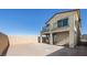 Backyard shows a large, dirt-filled area with a block wall and covered patio for outdoor enjoyment at 657 N Water St, Henderson, NV 89015