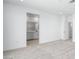 Bright bedroom with neutral carpet and a bathroom view in the background at 657 N Water St, Henderson, NV 89015