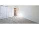 A bedroom with sliding door closet and neutral carpet at 657 N Water St, Henderson, NV 89015