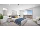 Stylish main bedroom with a balcony offering scenic views of the city skyline at 657 N Water St, Henderson, NV 89015