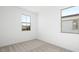 Bright bedroom with carpet and a window offering neighborhood views at 655 N Water St, Henderson, NV 89015