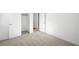 Clean bedroom with plush carpeting, closet and bright white trim at 655 N Water St, Henderson, NV 89015