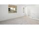 This is a bedroom with neutral walls and carpet and two windows at 655 N Water St, Henderson, NV 89015