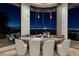 Stylish wet bar with counter seating and breathtaking city views at night at 1492 Macdonald Ranch Dr, Henderson, NV 89012
