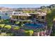 Stunning two-story home with stone accents, a pristine pool, and lush landscaping at 1492 Macdonald Ranch Dr, Henderson, NV 89012