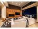 Open-concept living room with fireplace and city views through sliding glass doors at 1492 Macdonald Ranch Dr, Henderson, NV 89012