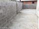 Backyard with cinderblock fence and concrete at 1929 Evelyn Ave, Henderson, NV 89011