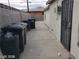 Backyard featuring cinderblock fence and side access door at 1929 Evelyn Ave, Henderson, NV 89011