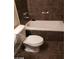 Bathroom with toilet and tub/shower combo with tiled walls at 1929 Evelyn Ave, Henderson, NV 89011