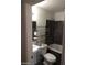 Bathroom with tub/shower combo, toilet, and pedestal sink at 1929 Evelyn Ave, Henderson, NV 89011