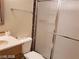 Bathroom featuring a toilet, vanity with storage, and shower with glass doors at 1929 Evelyn Ave, Henderson, NV 89011