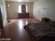Primary bedroom with a window, dresser, and wood-look flooring at 1929 Evelyn Ave, Henderson, NV 89011