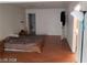 Large bedroom with walk-in closet, wood-look floors, and blank walls at 1929 Evelyn Ave, Henderson, NV 89011