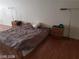 Bedroom with lamps and wood-look flooring. Ready for rest and relaxation at 1929 Evelyn Ave, Henderson, NV 89011