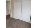 Neutral carpeted bedroom with white trim, baseboards, and double closet at 1929 Evelyn Ave, Henderson, NV 89011