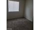 Neutral carpeted bedroom with window at 1929 Evelyn Ave, Henderson, NV 89011