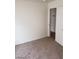 Neutral carpeted bedroom with white trim, baseboards, and door at 1929 Evelyn Ave, Henderson, NV 89011