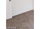 Neutral carpeted bedroom with white trim and door at 1929 Evelyn Ave, Henderson, NV 89011