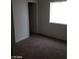 Carpeted bedroom with window and closet at 1929 Evelyn Ave, Henderson, NV 89011