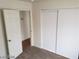 Neutral carpeted bedroom with white trim, baseboards, and double closet at 1929 Evelyn Ave, Henderson, NV 89011