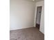 Neutral carpeted bedroom with white trim, baseboards, and door at 1929 Evelyn Ave, Henderson, NV 89011