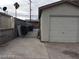 Spacious driveway and gated side yard offering ample parking and added security in this home's exterior at 1929 Evelyn Ave, Henderson, NV 89011