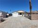Charming single-story home with a convenient driveway and a cozy front yard, perfect for a small Gathering at 1929 Evelyn Ave, Henderson, NV 89011