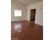 Open living area with wood flooring with view of the kitchen at 1929 Evelyn Ave, Henderson, NV 89011