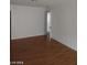 Spacious room with wood flooring, white trim and baseboards at 1929 Evelyn Ave, Henderson, NV 89011